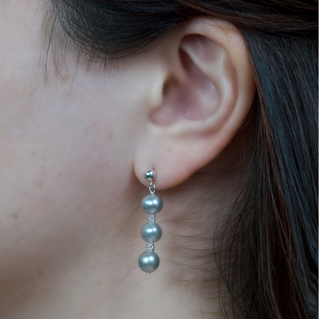Arnolfini Blue Pearl Earring Model Photo.webp